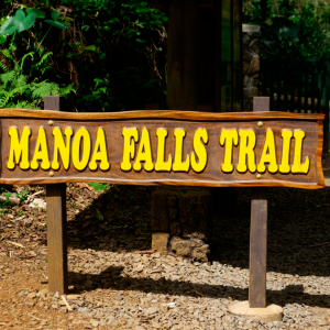 a sign on a wooden bench
