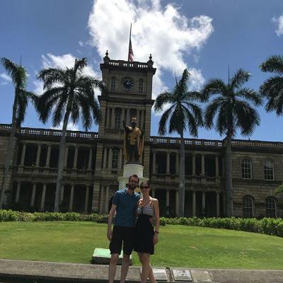 a person standing in front of a clock tower