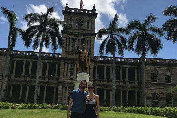 a person standing in front of a clock tower