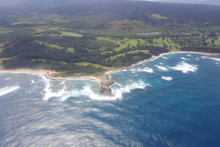 a view of a body of water with a mountain in the background