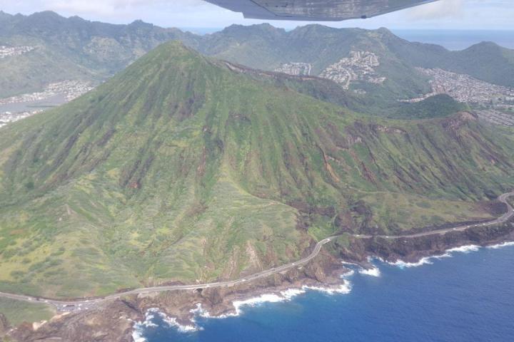 a body of water with a mountain in the background