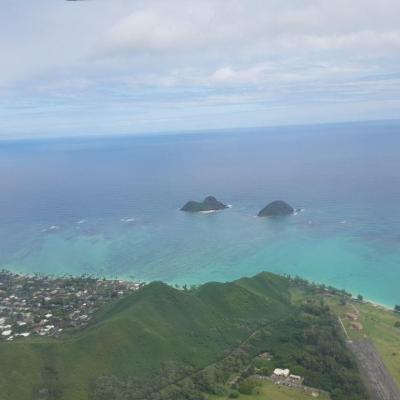 a large body of water with a mountain in the background
