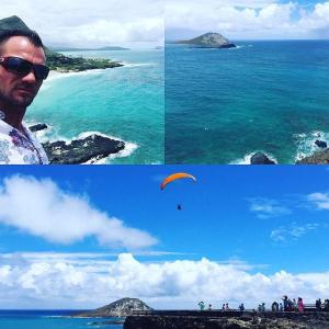 a man standing next to a body of water next to the ocean